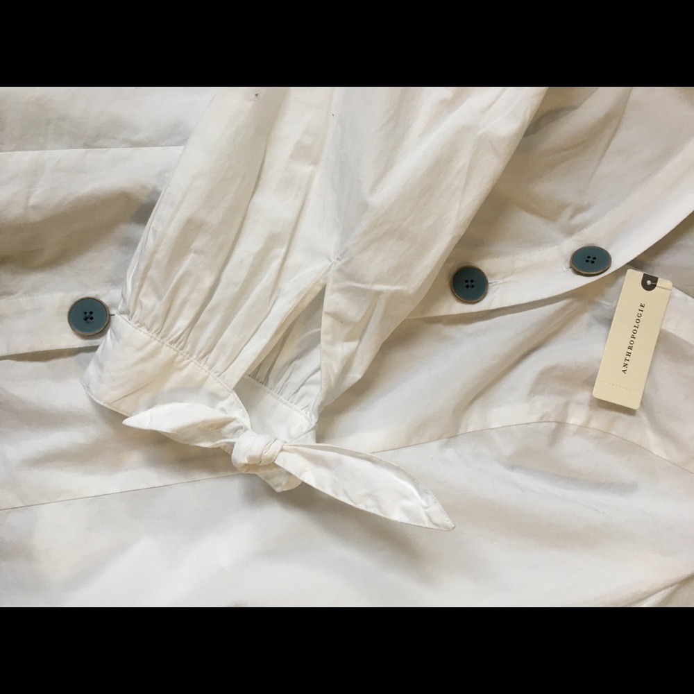 White button up shirt with fun detailing.